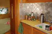 Photo of kitchen cabinets and tile back-splash in restored 1949 Star Trailer